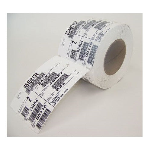Close-up of perforated orange thermal transfer tags on a 76mm core roll