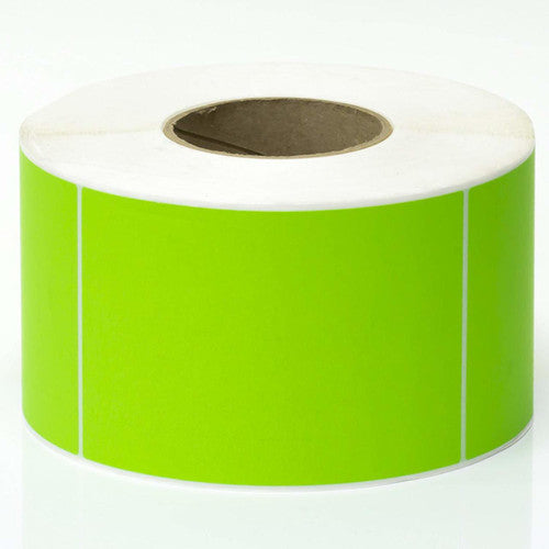 Close-up of perforated fluoro green thermal transfer label surface showing adhesive backing