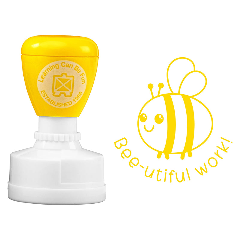 Product image showing the Bee-utiful Work merit stamp alongside its detailed bee character impression on a clean background. The self inking design and bold message make it ideal for rewarding excellent classroom performance.