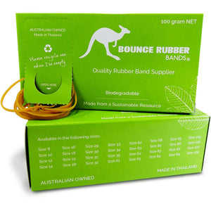 Close view of a green Bounce Rubber Bands 100g dispenser box with natural tan bands drawn through the OPEN HERE tab and a side panel listing the sizes Bounce offer in this box format (SRETBANDASSN)