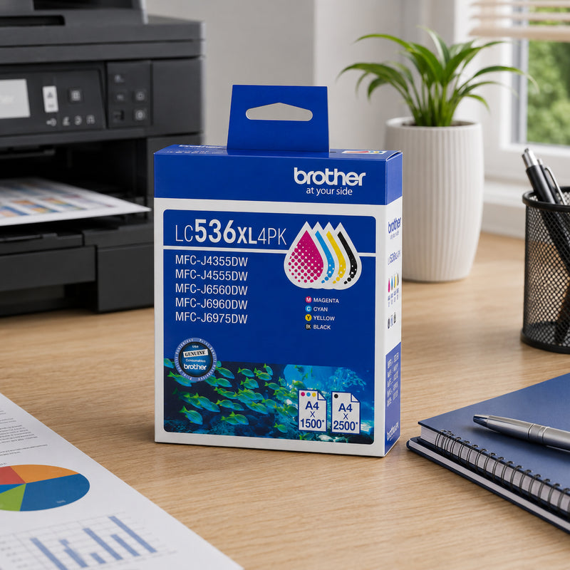 Angled product display of the Brother LC536XL4PK High Yield BCMY Ink Cartridge Multipack placed on a desk alongside printed charts, business reports and office accessories. The Brother printer in the background reinforces compatibility and intended use. The image highlights the convenience of having all four genuine Brother cartridges in one pack, making it ideal for continuous office productivity and vibrant colour output.
