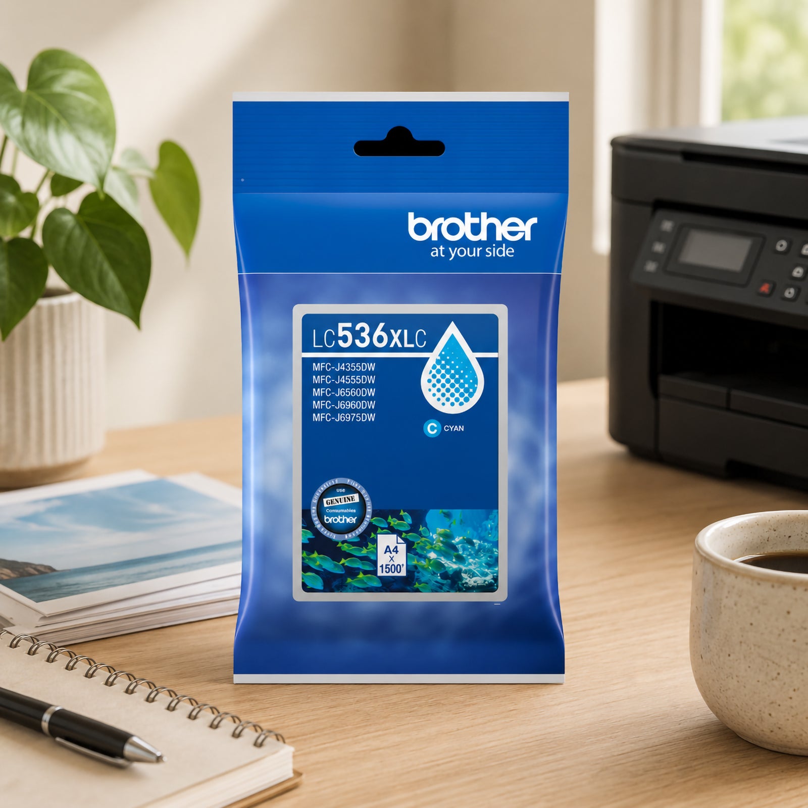 Lifestyle office image featuring the Brother LC536XLC High Yield Cyan Ink Cartridge standing on a tidy workstation with a Brother printer in the background. Printed business charts, stationery items and decorative plants surround the product, showcasing its suitability for professional environments that require dependable colour printing, presentations and day to day document production.