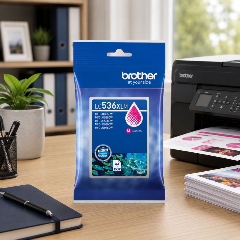 Brother LC536XLM genuine magenta ink cartridge package positioned on a modern workstation next to a Brother multifunction printer and freshly printed colour documents. Office accessories, filing shelves and indoor plants create a productive business environment. The image showcases the cartridge as a reliable solution for consistent colour printing in home offices and professional workplaces.