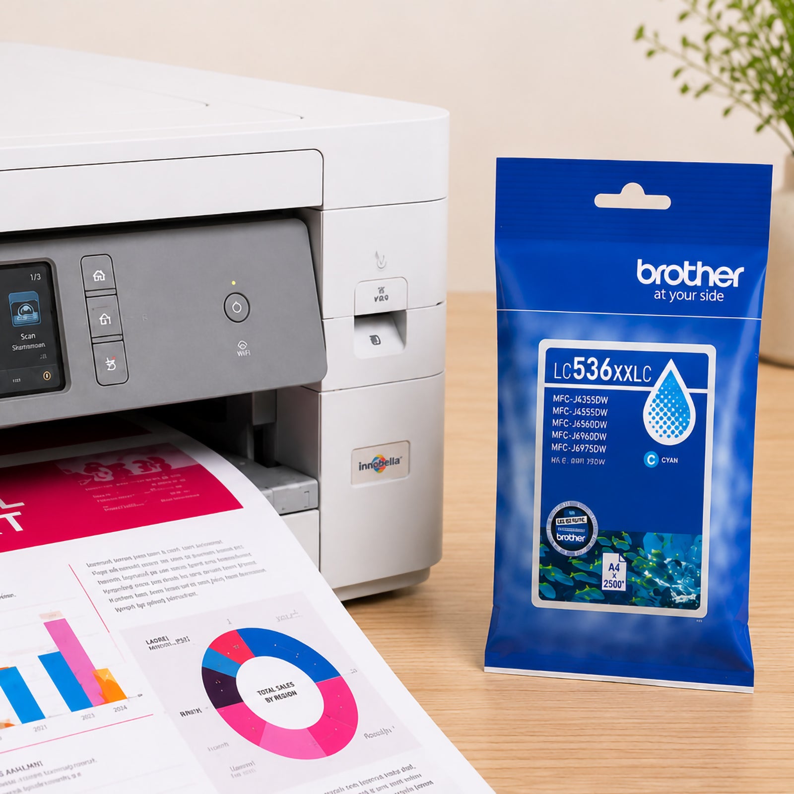 Brother multifunction printer producing colourful business reports while a genuine Brother LC536XXLC super high yield cyan ink cartridge package stands beside the device. The image highlights professional colour printing, reliable office performance and vibrant document output for demanding work environments.
