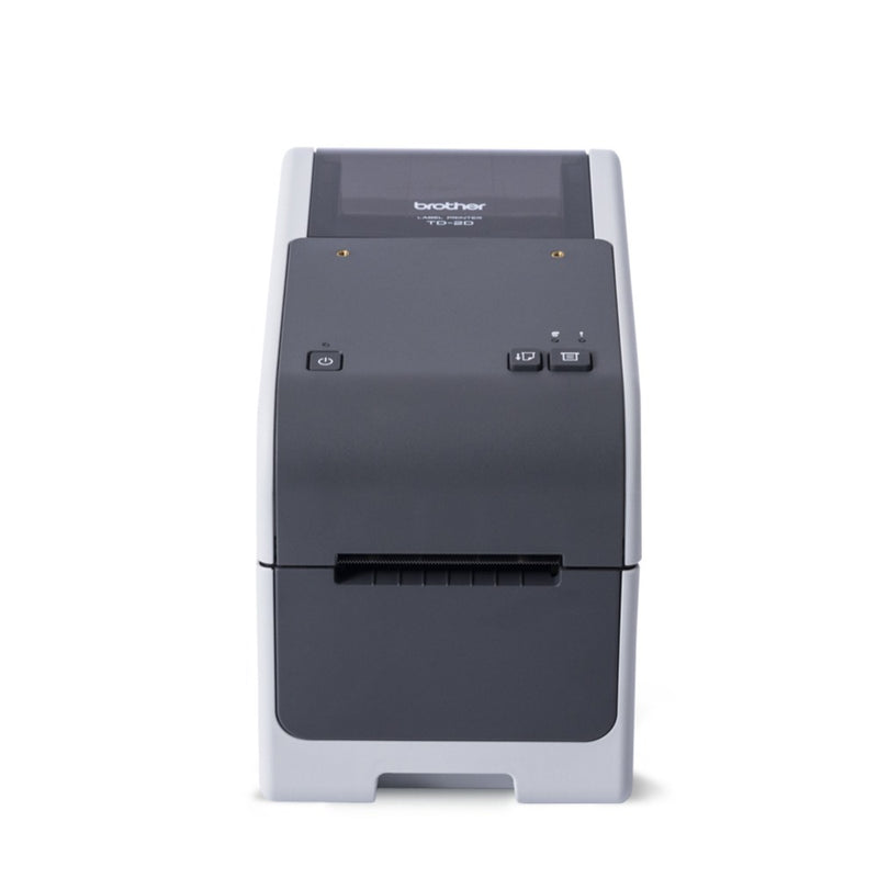 Front view of the Brother TD-2320D showing the dark grey control panel with power, feed and print buttons, indicator lights and the label exit slot below.