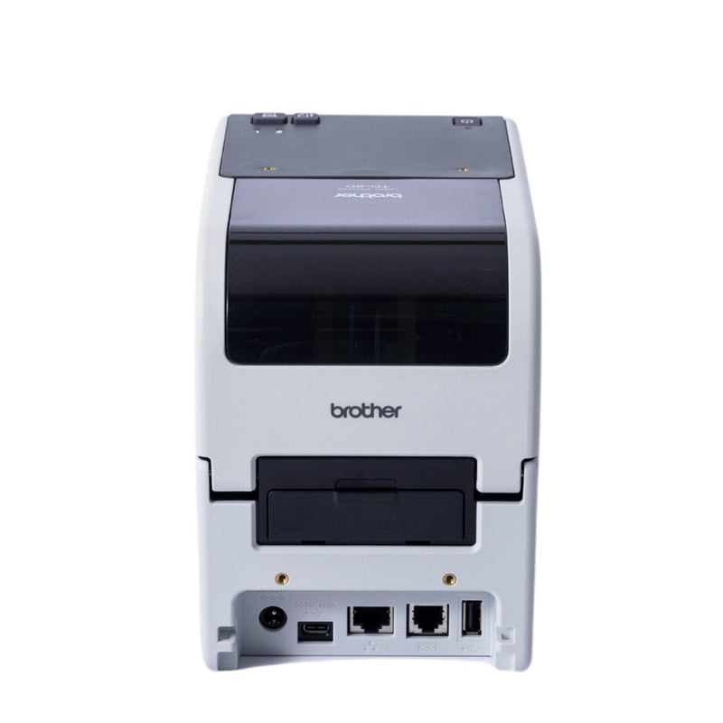 Rear of the Brother TD-2320D showing the power socket, a USB-C port, two RJ-style sockets and a USB Type A port along the bottom edge, with the buttons visible on top.