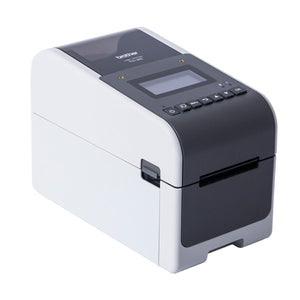 Brother TD-2350D label printer from the front left, white body with a dark grey top, a monochrome LCD screen and a row of seven buttons including Menu and OK above the label exit.