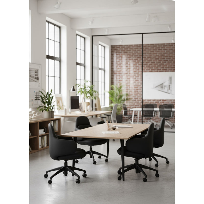 Open plan office with black Buro Odyssey chairs arranged around timber topped meeting tables