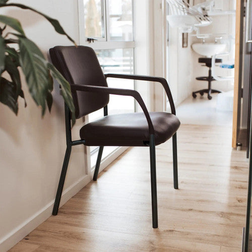 Close-up of black polypropylene arms on the Buro Lindis 4 Leg chair