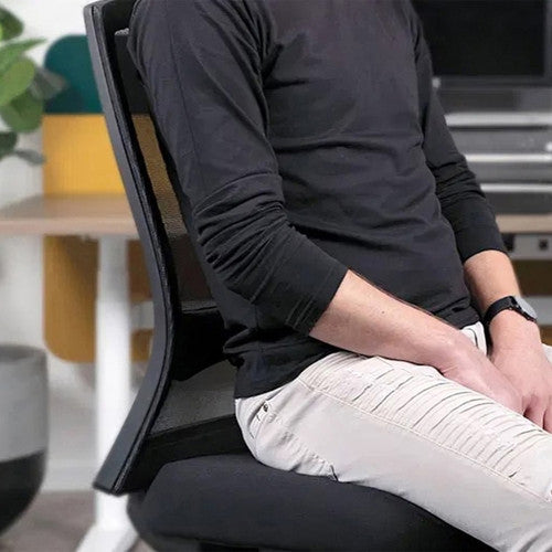 Buro Mentor armless office chair shown at a desk in a modern workplace setting