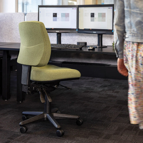 Buro Roma mid back chair in office environment, angled view showing seat depth adjustment