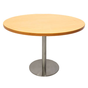 Rapidline Estilo 1200mm round table with a beech top on a stainless steel column and flat disc base, viewed from slightly above