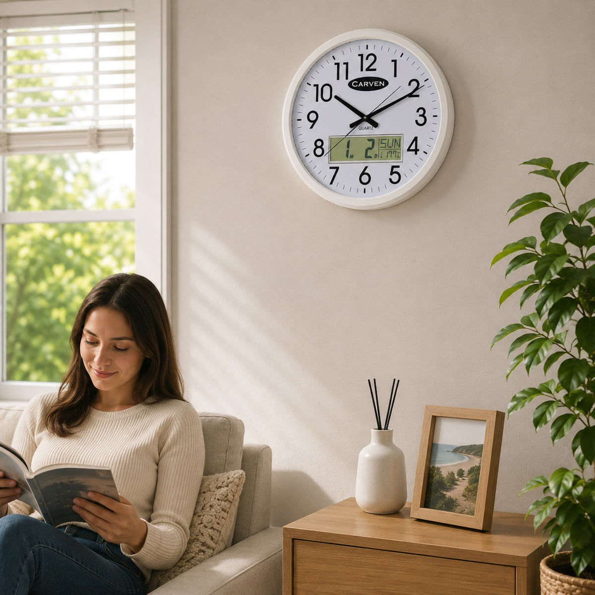 Room setting image of the Carven 470mm white clock on a wall above a lounge with a person reading, supplied with the listing