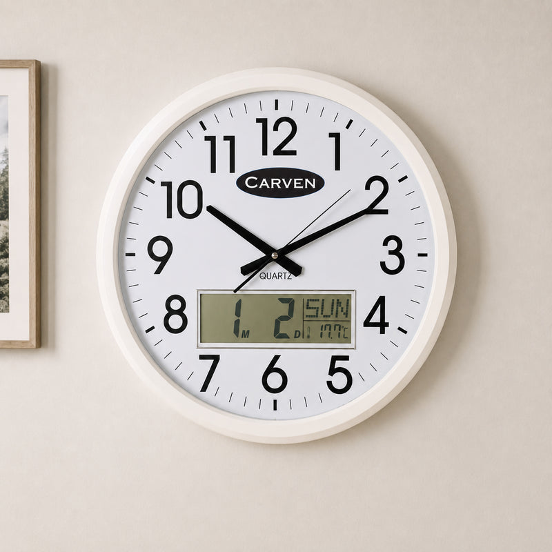 Close up of the Carven 470mm LCD Calendar Wall Clock mounted on a neutral coloured wall. The oversized black numerals, white frame and digital LCD panel displaying the day, date, month and temperature are clearly visible for easy reading from a distance.