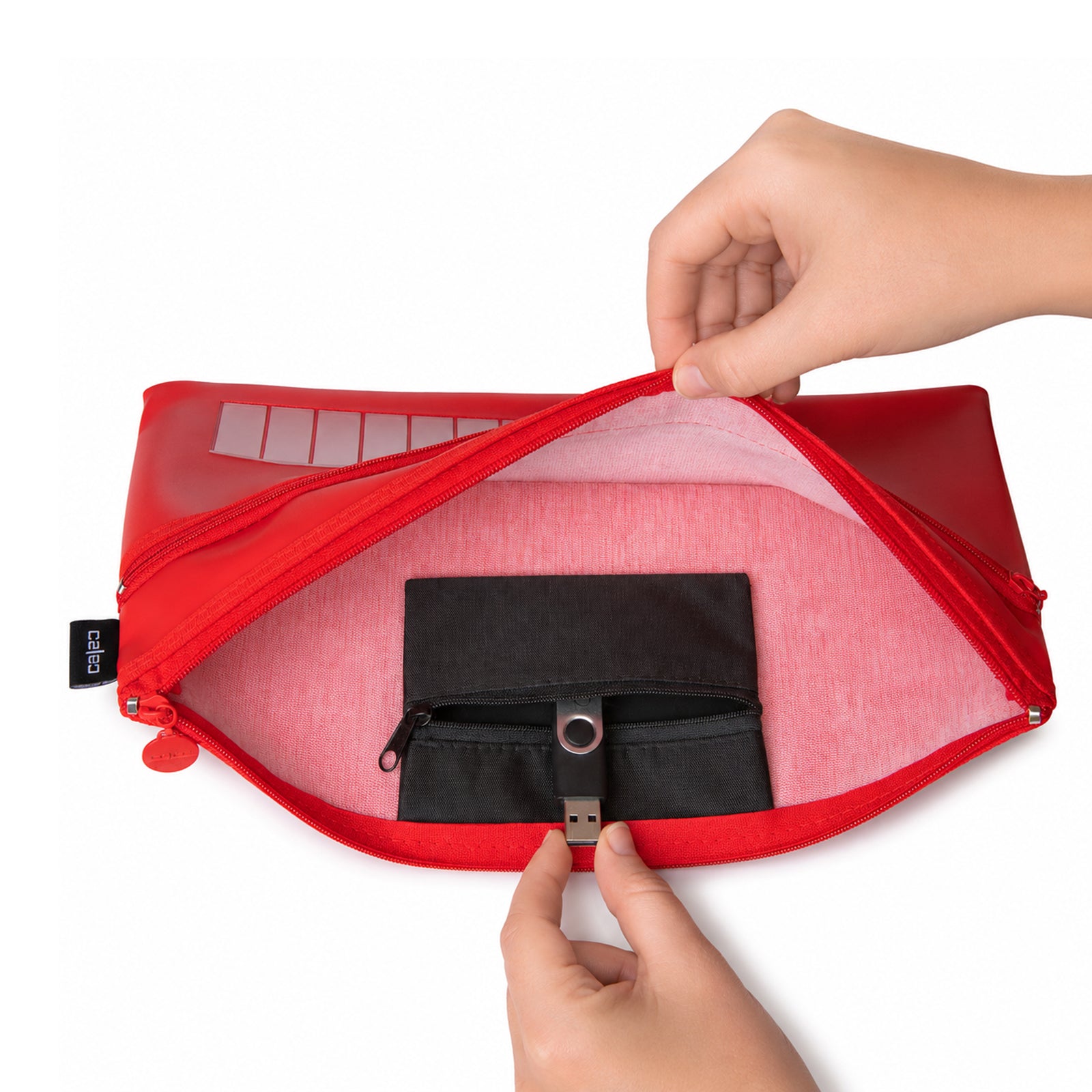 A close up view inside the fully opened Celco Large 2 Zip Name Pencil Case reveals the spacious interior lining and dedicated internal USB storage pocket. A USB flash drive is stored neatly inside, highlighting secure organisation for modern school and office accessories.