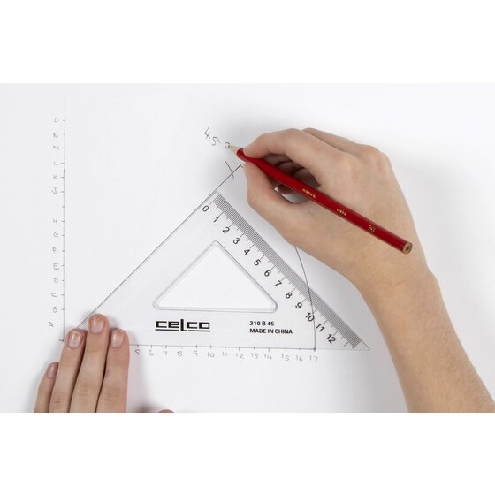 Hand drawing a pencil line against the edge of a clear Celco 45 degree set square on white paper, with measurement marks along the page
