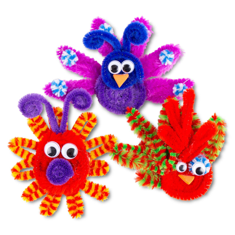 Close up view of three completed chenille stem creatures crafted from textured stems and pom poms. The colourful bird and animal designs showcase the creative possibilities and unique visual effects achieved using chenille stems and bumps.