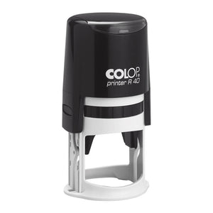 Colop R40 self-inking stamp with a round black top cap over a white base, shown upright on a white background