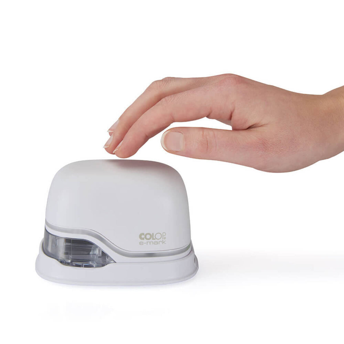 Hand resting on top of the white Colop e-mark handheld printer on a plain white background, showing its compact size