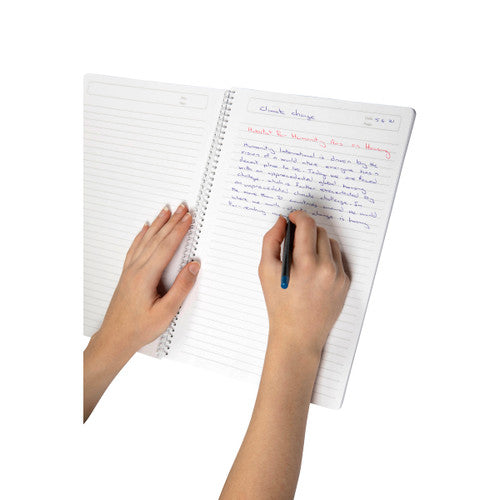 Close-up of ColourHide A4 notebook showing perforated ruled pages and built-in pen holder