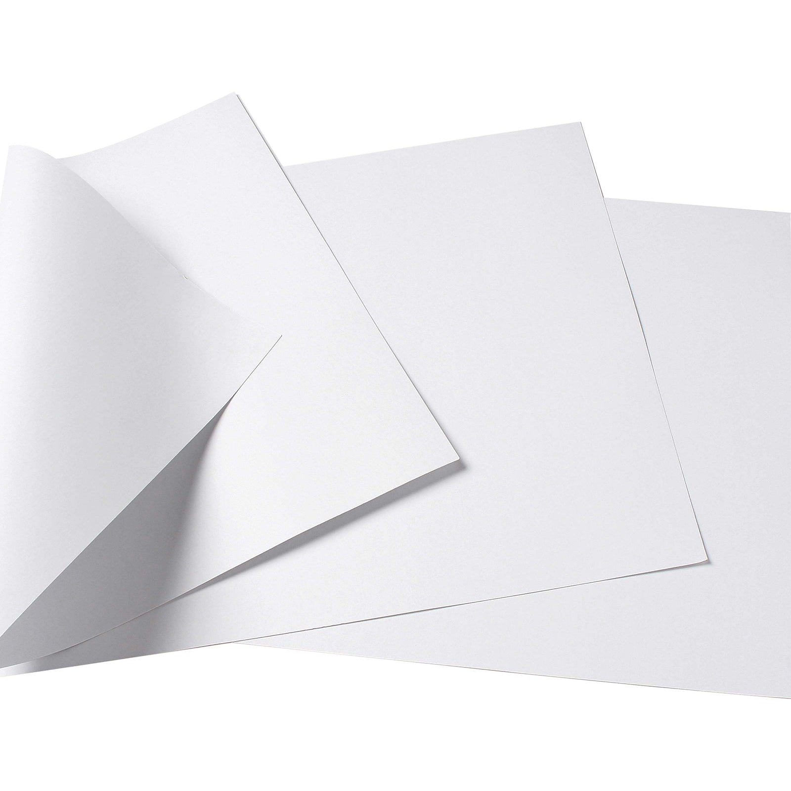 Close up of multiple whiteboard pasteboard sheets layered together, with one corner lifted to display the sturdy construction and smooth finish. The image highlights the quality surface coating and flexibility designed for repeated classroom use.