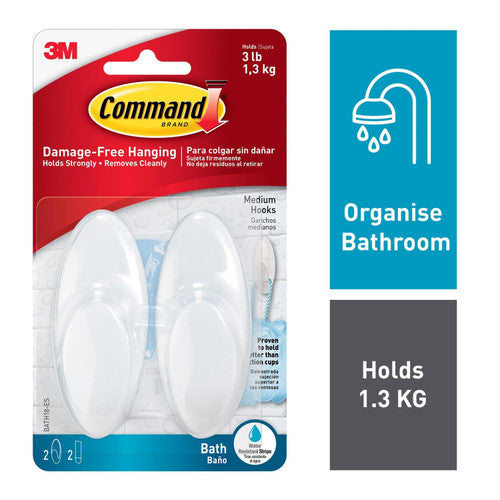 Command bath hook mounted on bathroom tile holding a towel