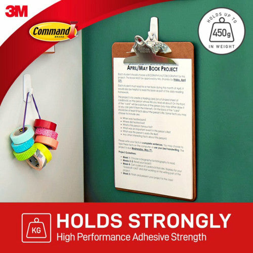 Command Small Hook holding a tea towel on a kitchen cabinet door