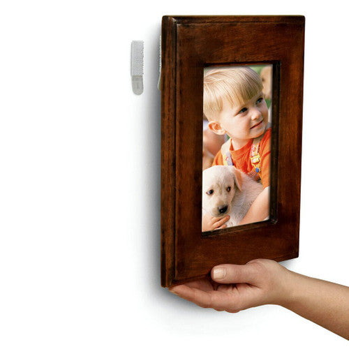 Command strips applied to back of a small picture frame