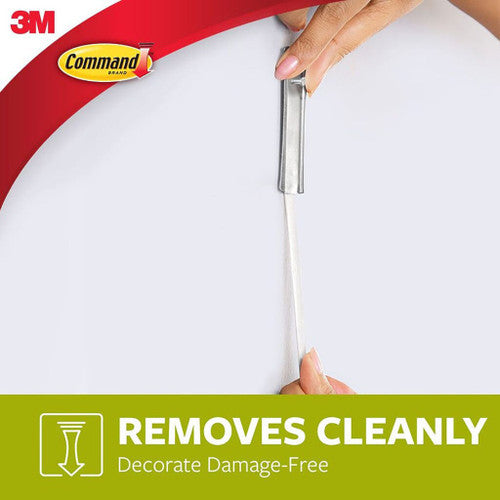 Command hanger being removed cleanly from wall with no damage