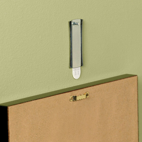 Command picture hanger mounted on painted plasterboard wall