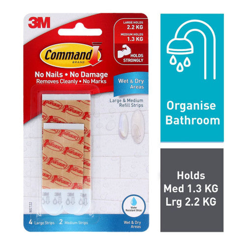 Command refill strips adhered to a tiled bathroom wall holding a hook