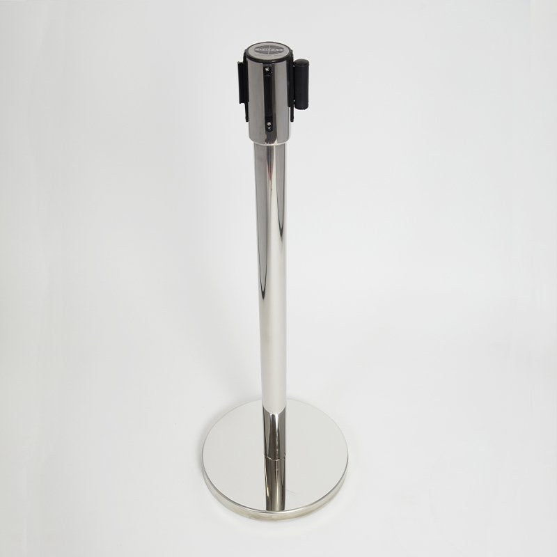 Compass polished barrier post with the belt retracted, standing on its round mirror finish base against a grey backdrop