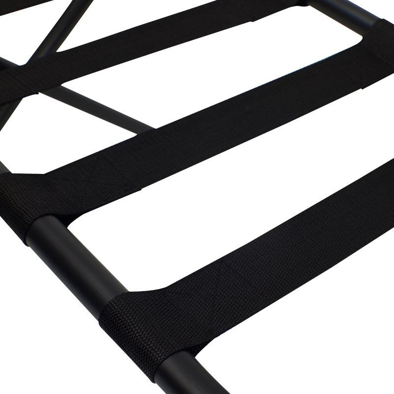 Close view of the black webbing straps stretched across the Compass luggage rack frame