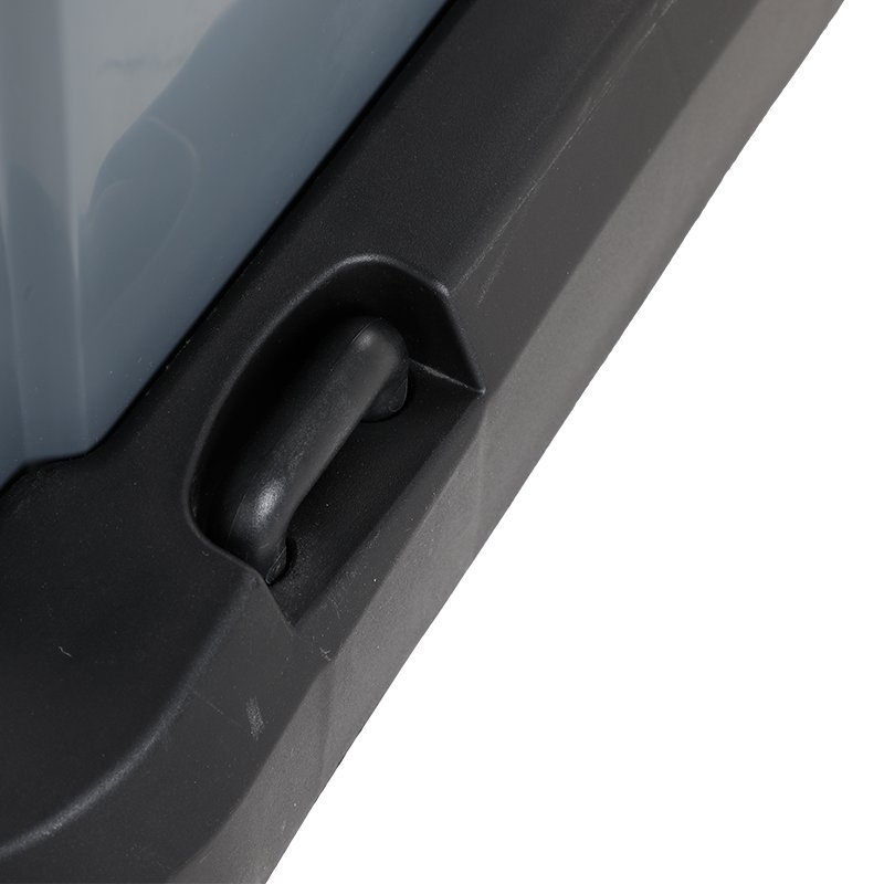 Close-up of the hook moulded into the side of the black base next to the grey bin
