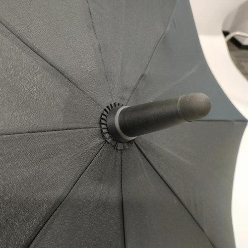 Bulk pack of 24 Compass large black umbrellas stacked for commercial storage