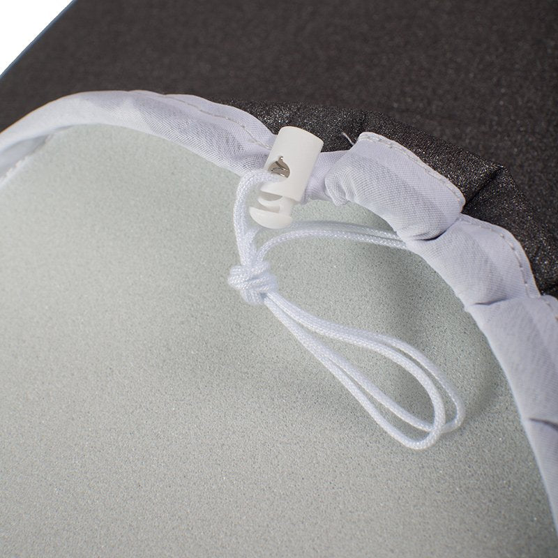 Close-up of the white drawstring cord and white toggle on the hem of the cover, with the grey foam backing
