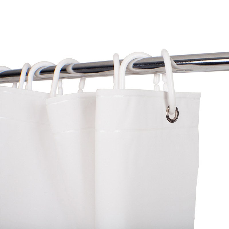 Close-up of the top hem of the Compass white shower curtain, metal eyelets threaded with white plastic rings on a chrome rail