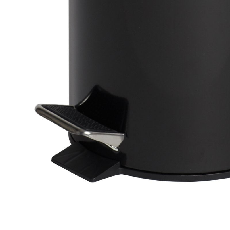 Close view of the foot pedal at the base of the gloss black Compass pedal bin