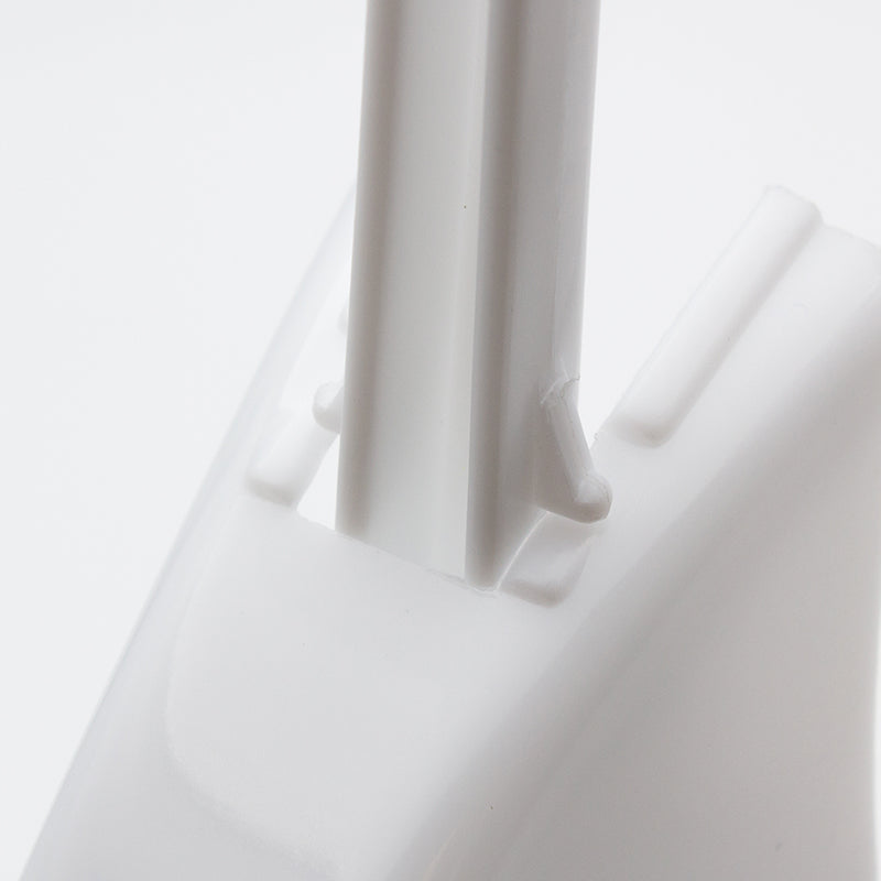 Close-up of the white handle held in the slot at the top of the holder between two lugs