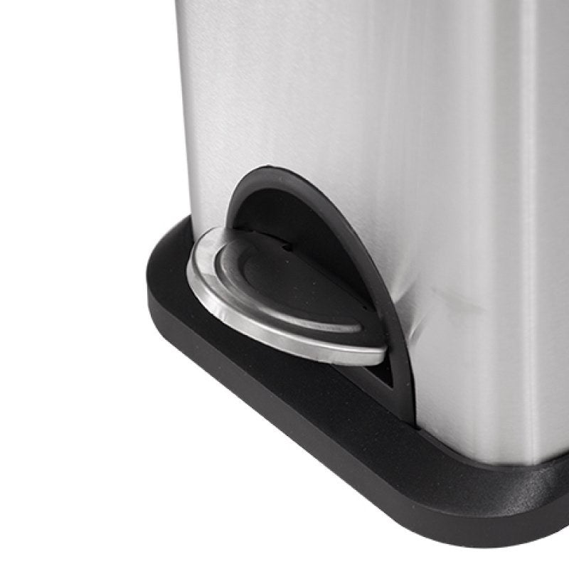 Close view of the black base and chrome foot pedal of the Compass rectangular stainless pedal bin