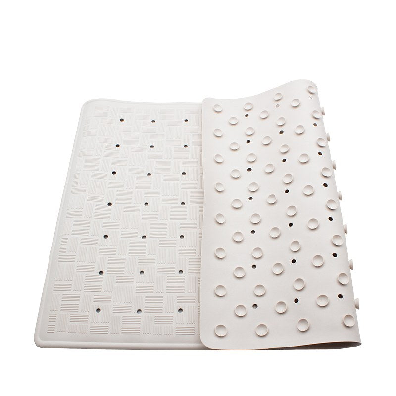 Compass small off-white rubber bath mat with one end turned back to reveal the cupped underside beside the basket-weave top