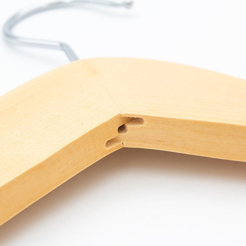 Close view of the centre joint where the two light wood shoulders of the Compass hanger meet