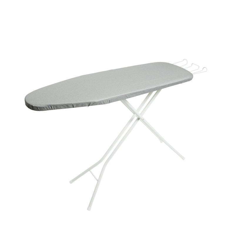 Compass standard ironing board open with a silver cover on a white tubular frame and a white wire iron caddy at the end