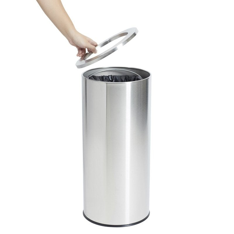 A hand lifting the stainless top ring off the Compass 45 litre tidy bin, with a bag visible inside the liner
