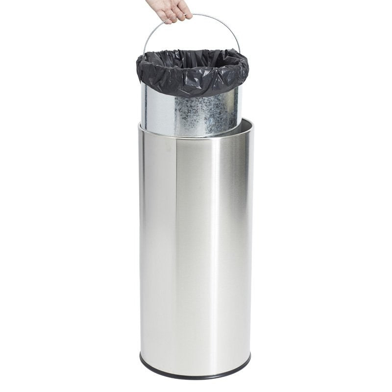 The galvanised liner with a black bag being lifted out of the Compass 45 litre tidy bin by its wire handle