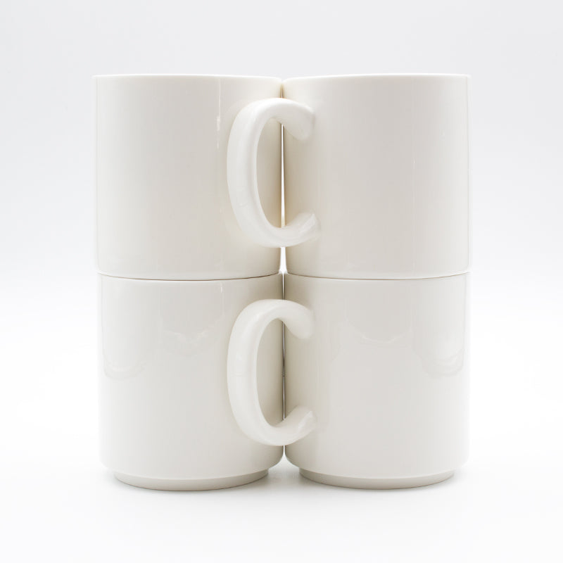 Four white Connoisseur stackable mugs stacked two high in two columns with their handles facing each other