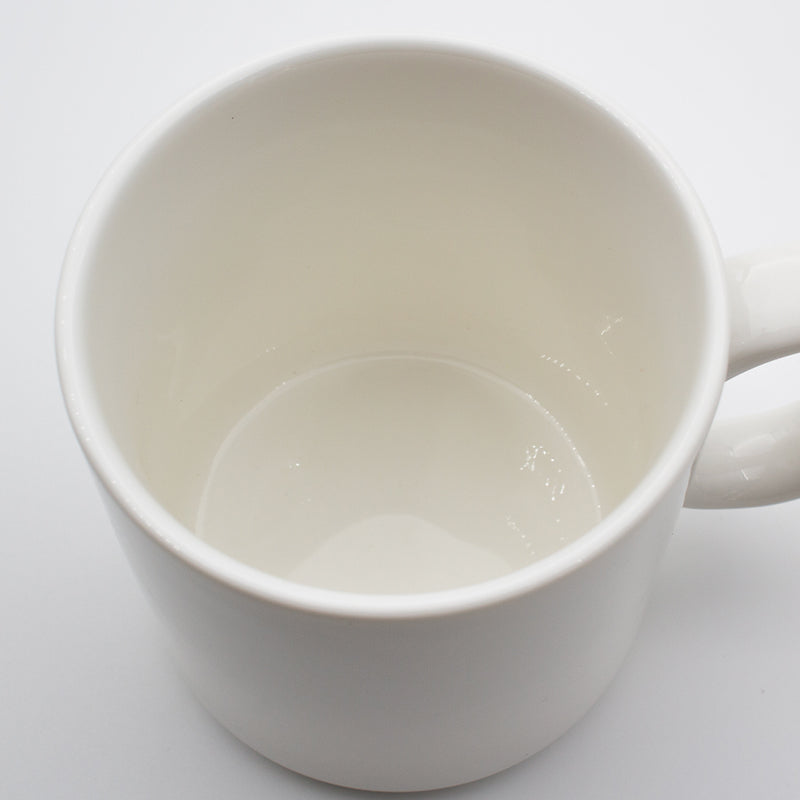 Looking down into a white Connoisseur stackable mug, showing the glazed interior and rim