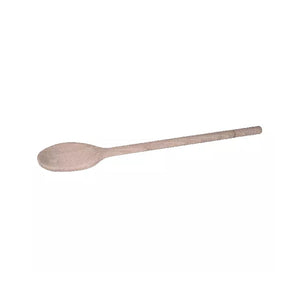 Connoisseur 300 mm beechwood cooking spoon lying at an angle on white, light tan wood with an oval bowl and a long plain handle