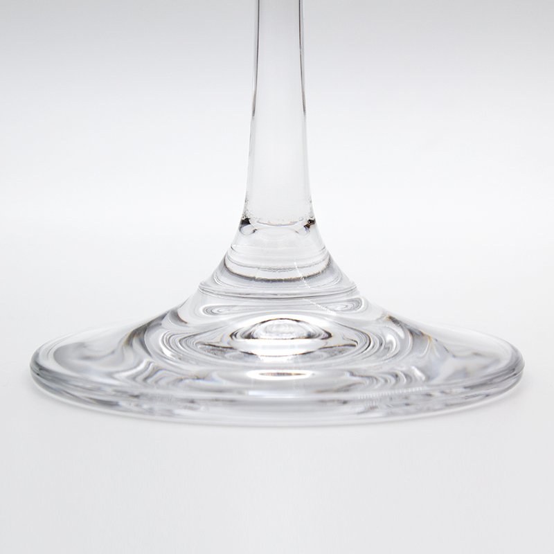 Close-up of the stem of a Berlin wine glass flaring into its wide round foot
