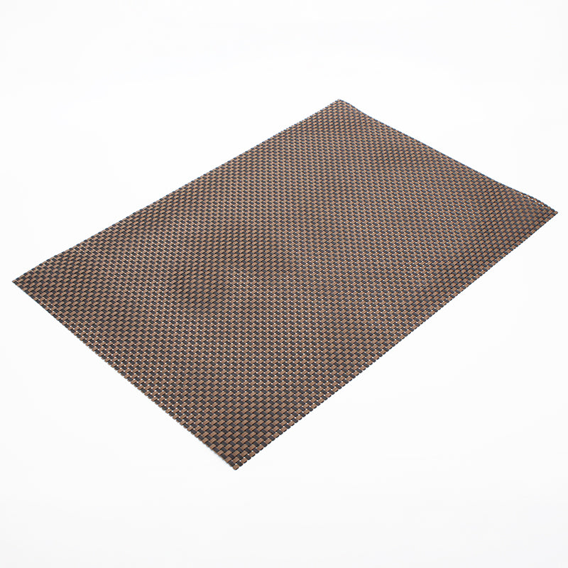 Tight close-up of the placemat weave, showing striped tan strands woven over and under black strands